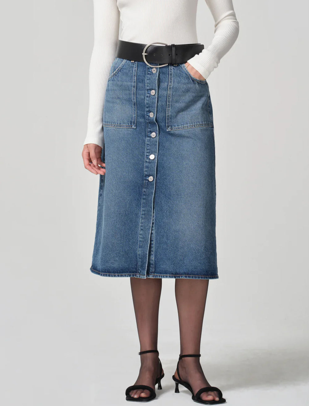 Model wearing Citizens of Humanity's anouk skirt in first class.