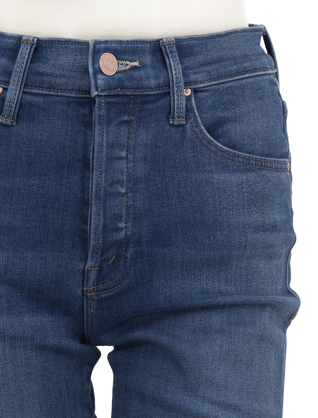Close-up view of Mother Denim's high waisted hiker hover in across the finnish line.
