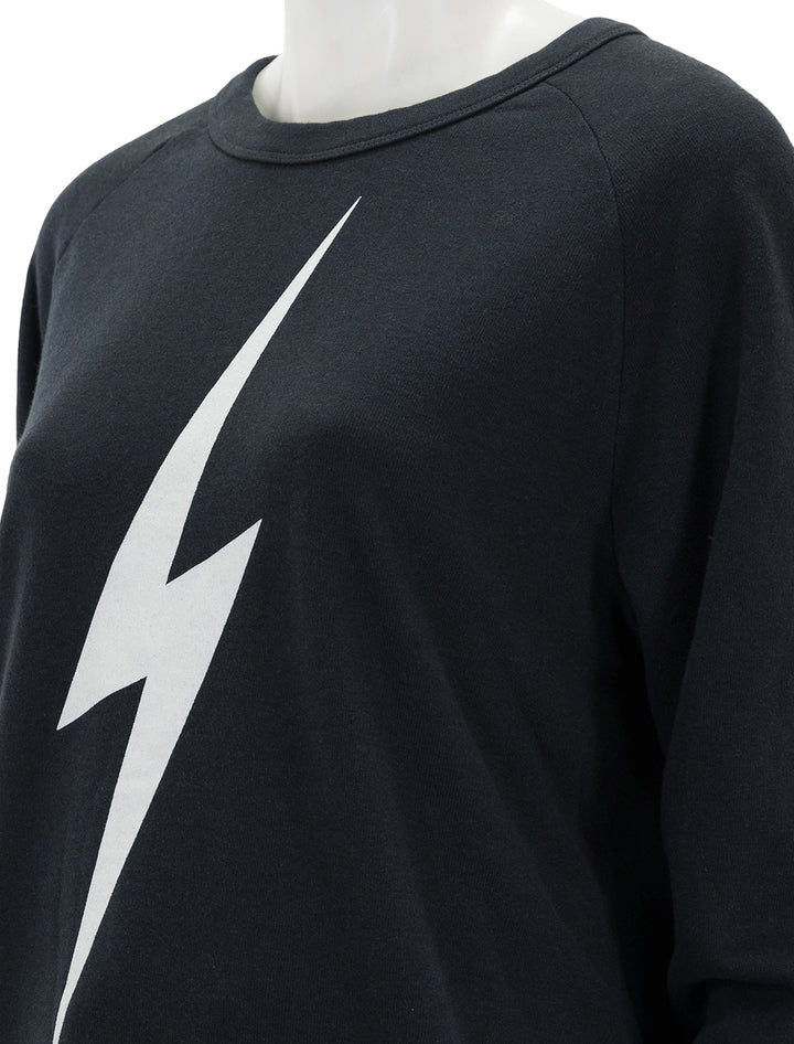 Close-up view of Aviator Nation's bolt sweatshirt in charcoal.