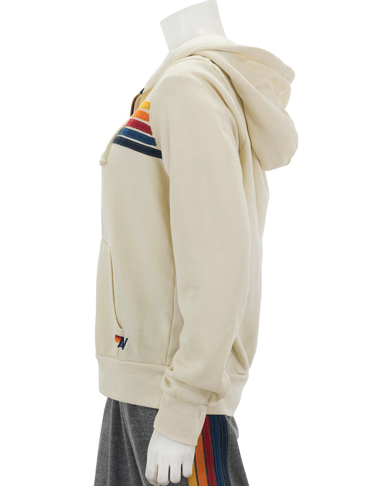 Side view of Aviator Nation's 5 stripe zip hoodie in vintage white.