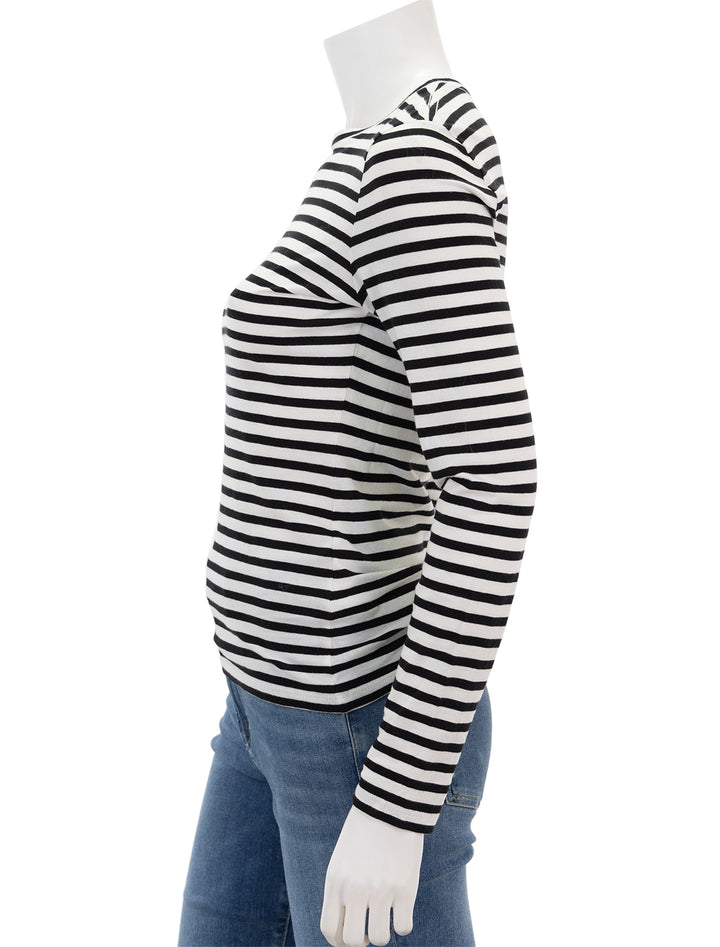 Side view of Nili Lotan's susana long sleeve tee in black and white stripe.