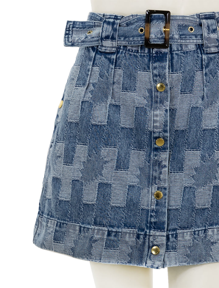 Close-up view of Barbour's bowhill mini skirt in patchwork denim.