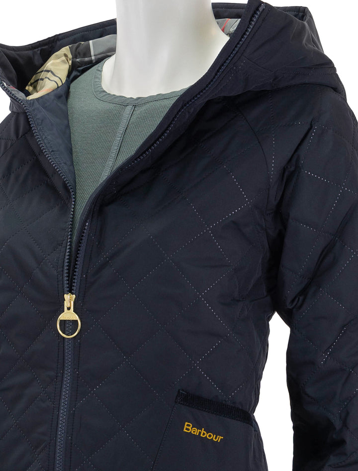 Close-up view of Barbour's glamis quilt jacket in dark navy.
