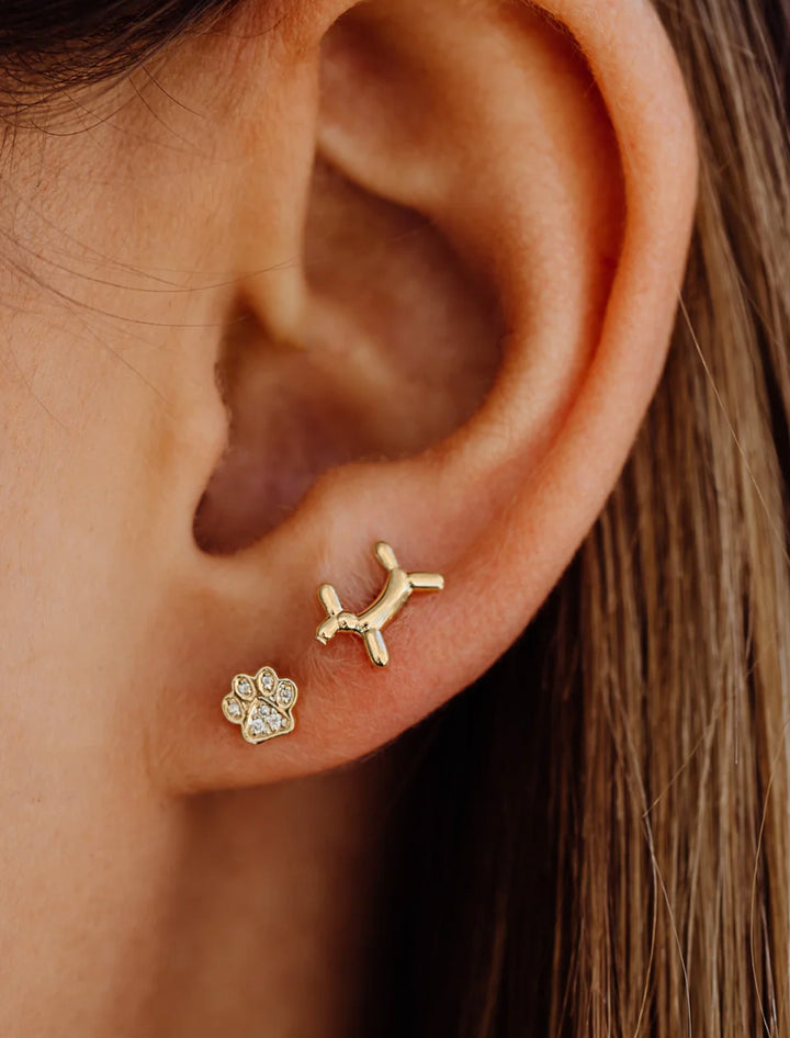 Model wearing Sydney Evan's Mini Pave Paw Studs.
