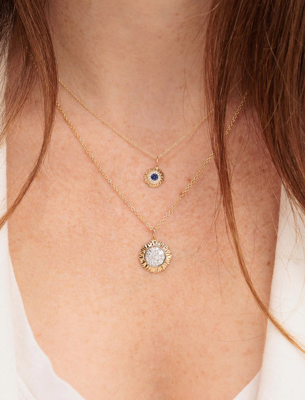 Model wearing Sydney Evan's pave sunflower charm necklace with sapphire and diamond.