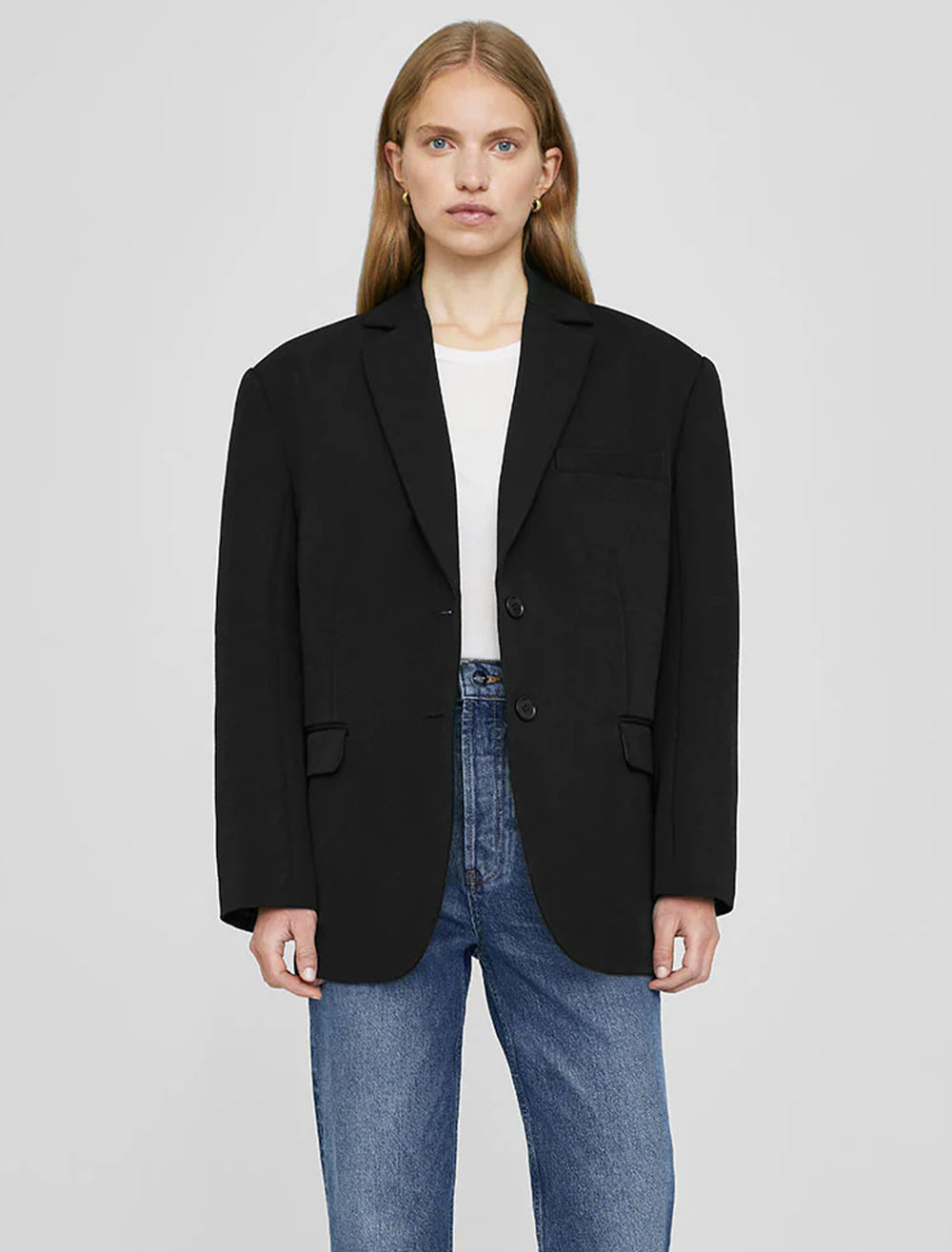 Model wearing Anine Bing's quinn blazer in black.