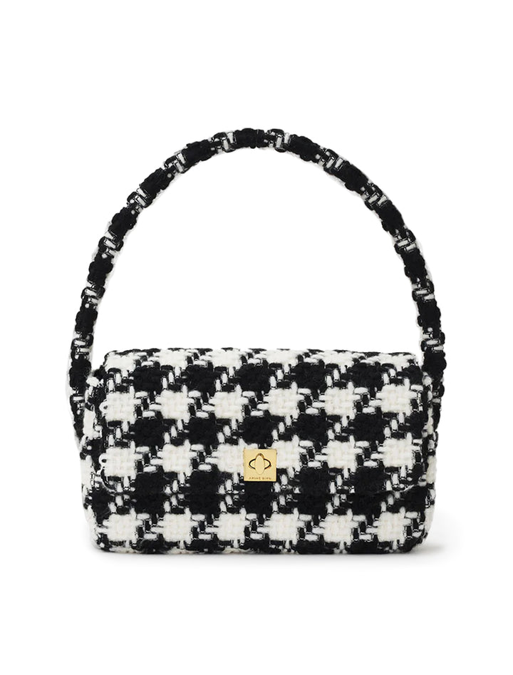 Front view of Anine Bing's nico handbag in black and white houndstooth.
