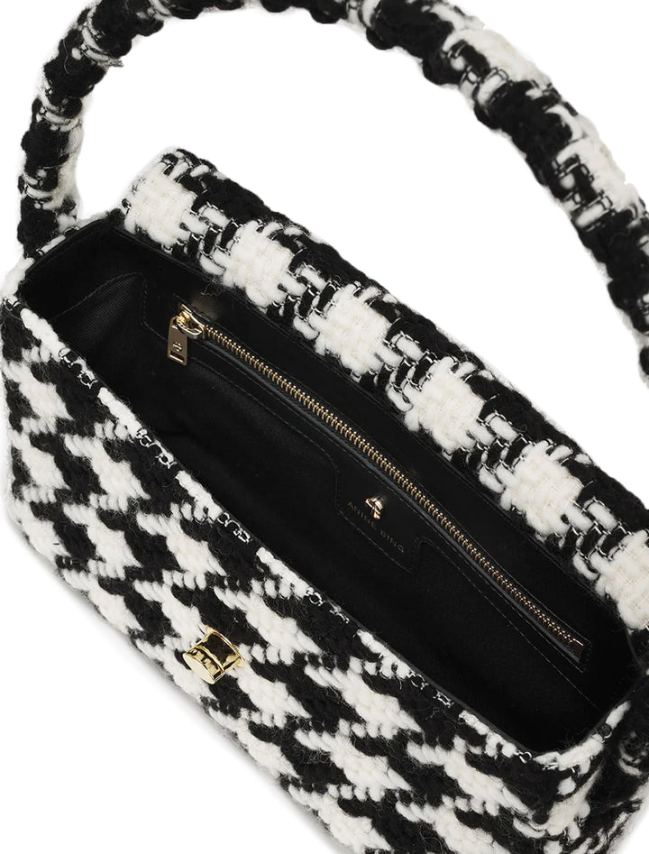 Overhead view of Anine Bing's nico handbag in black and white houndstooth.
