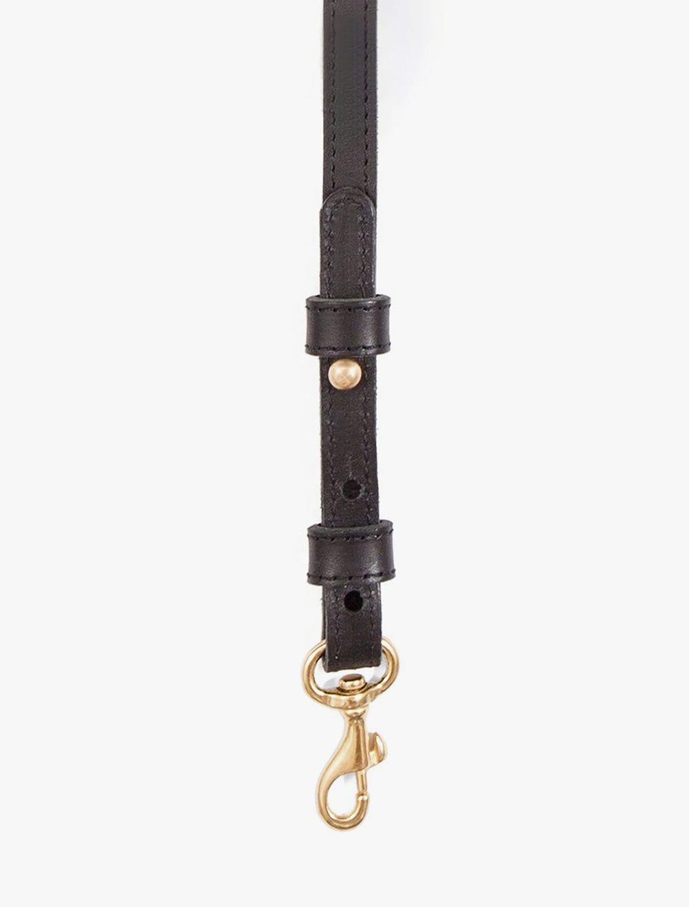 Close-up view of Clare V.'s adjustable crossbody strap in black.