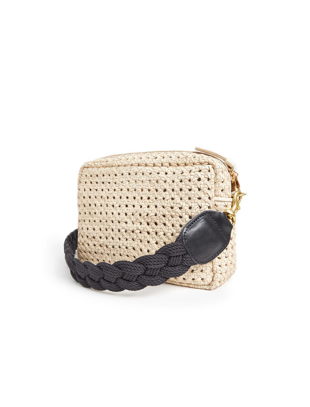 Clare V.'s braided rope crossbody strap in black on a cream bag.