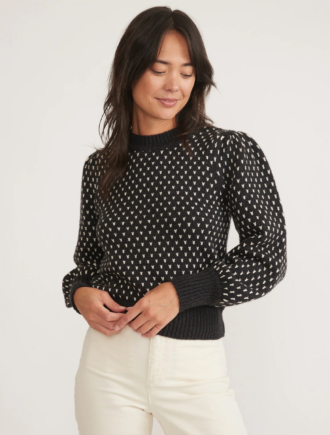 model wearing alma puffsleeve sweater in black and white