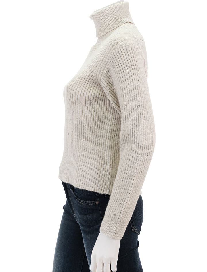 Side view of Marine Layer's isla knit turtleneck in oatmeal.