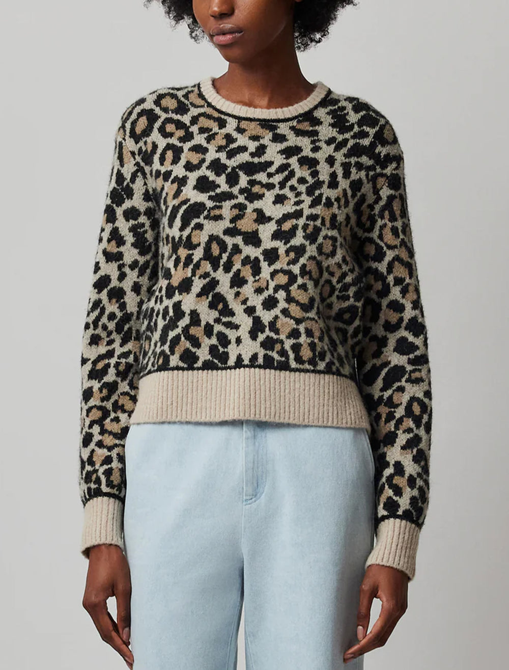 Model wearing ATM's leopard jacquard pullover.