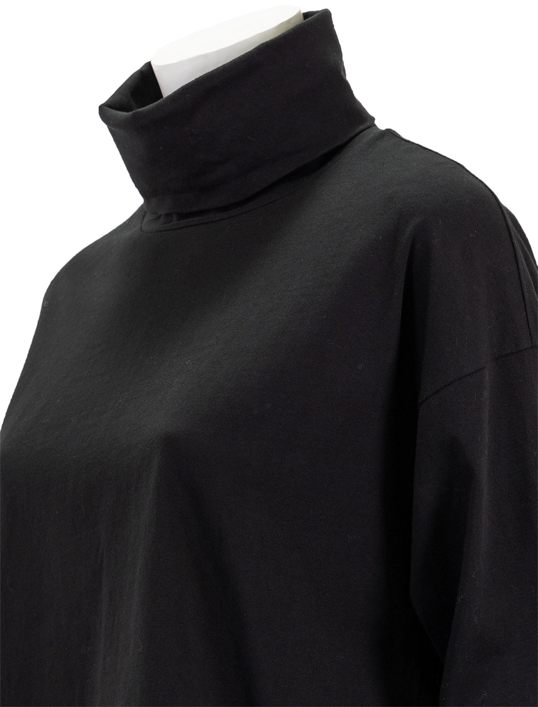 Close-up view of ATM's heavy cotton oversized turtleneck in black.