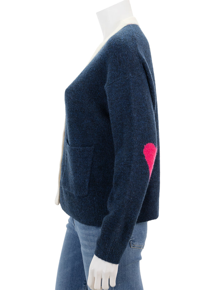 Side view of Sundry's heart boxy cardigan in midnight and cream.