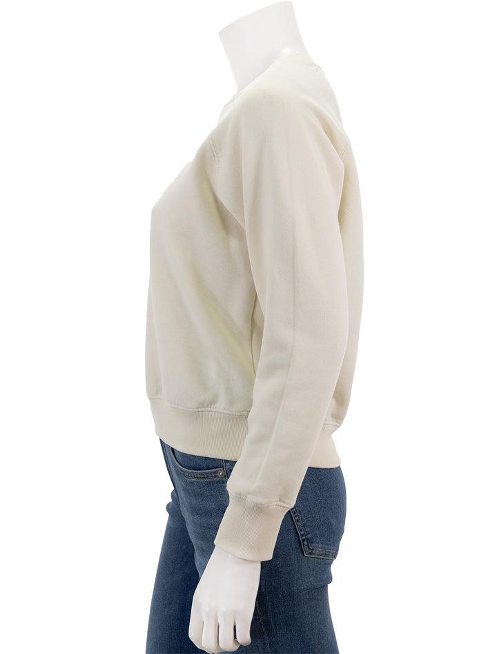 Side view of Sundry's love sweatshirt in cream.