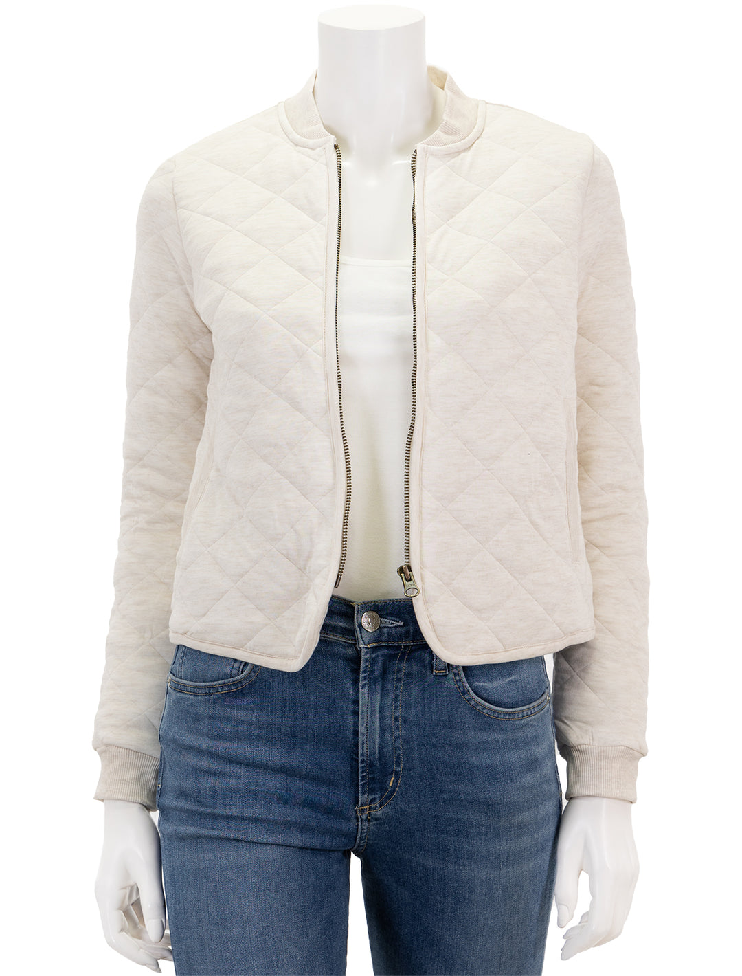 Front view of Marine Layer's updated corbet quilted bomber in antique white, unzipped.