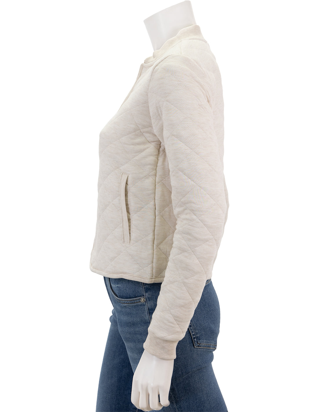 Side view of Marine Layer's updated corbet quilted bomber in antique white.