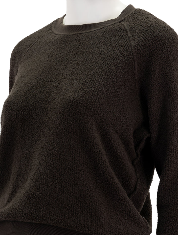 Close-up view of Perfectwhitetee's ziggy inside out sweatshirt in cafe.