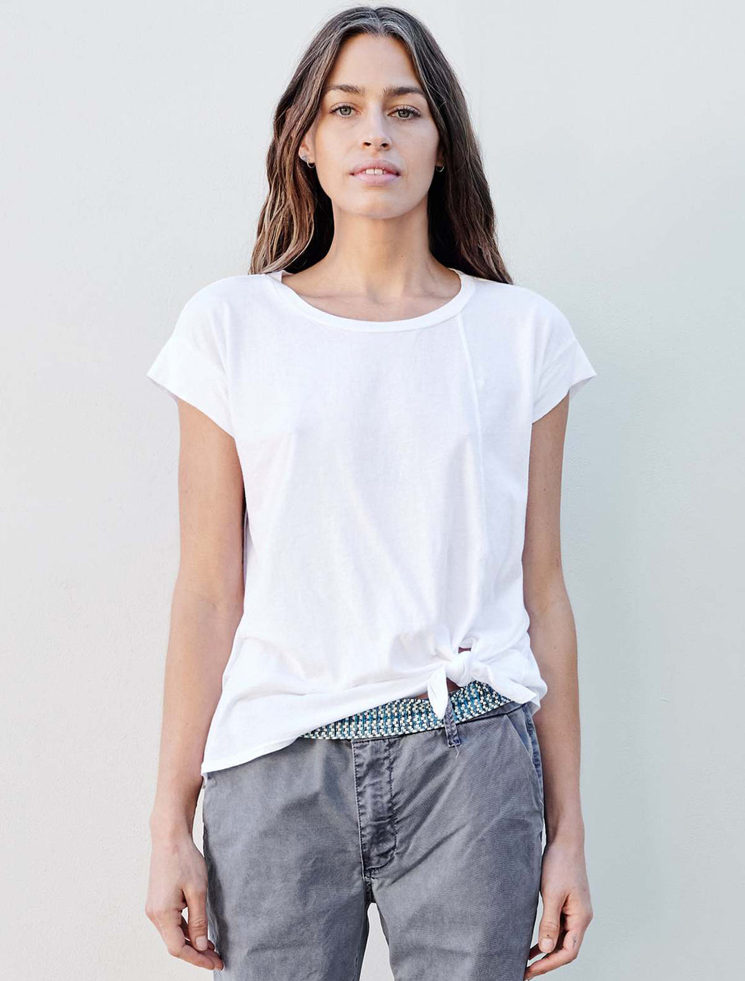 Model wearing Sundry's muscle tee with side slit in white.