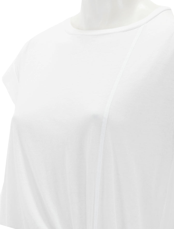 Close-up view of Sundry's muscle tee with side slit in white.