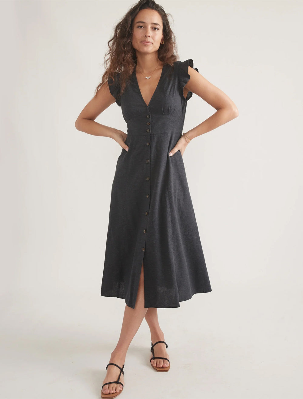 model wearing camila midi dress in black