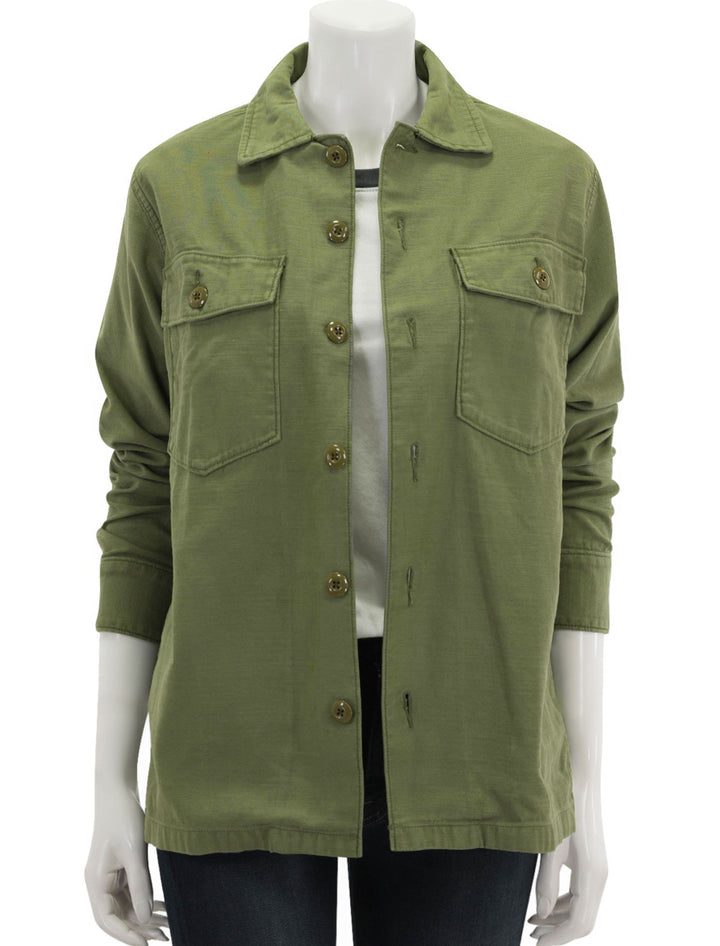 Front view of Faherty's savannah cotton overshirt in fatigue, unbuttoned.
