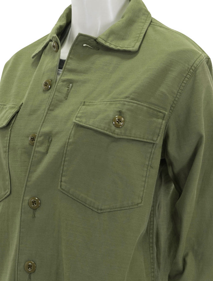 Close-up view of Faherty's savannah cotton overshirt in fatigue.