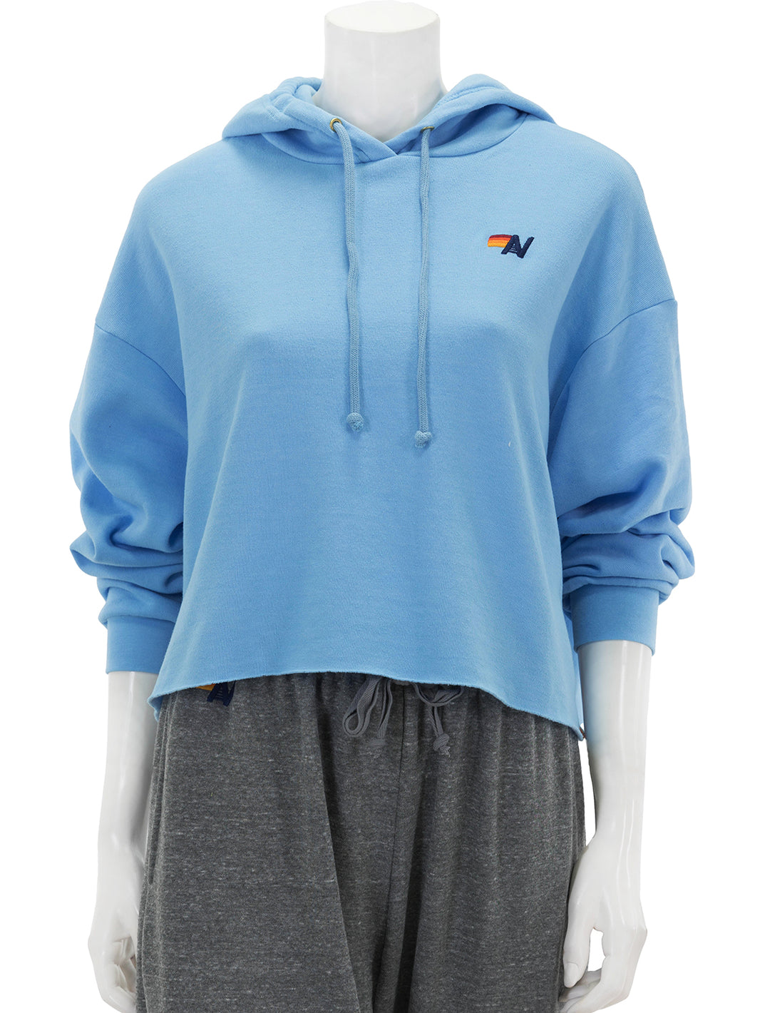 Front view of Aviator Nation's bolt stripe relaxed cropped pullover hoodie in sky.