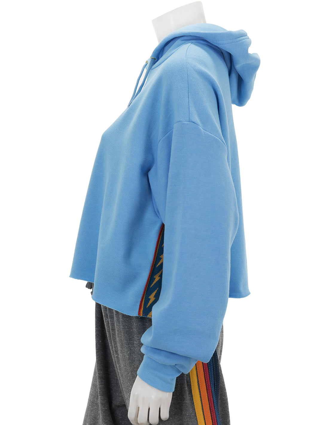 Side view of Aviator Nation's bolt stripe relaxed cropped pullover hoodie in sky.