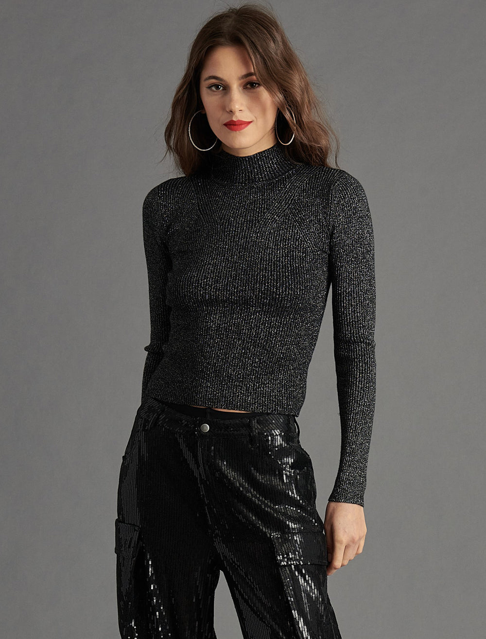Model wearing Steve Madden's serita sweater in black.