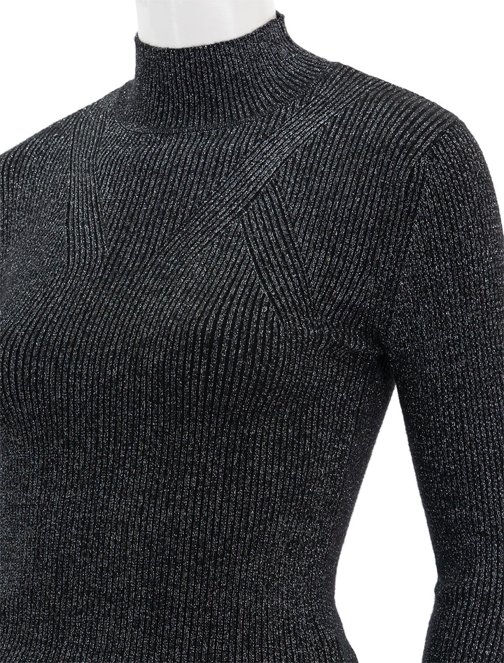 Close-up view of Steve Madden's serita sweater in black.