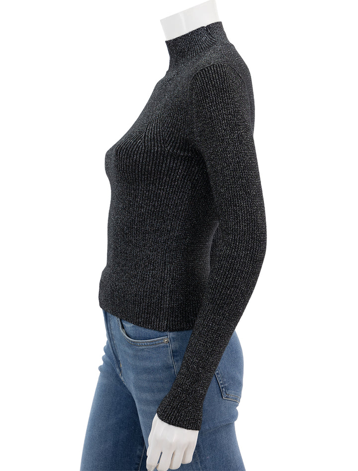Side view of Steve Madden's serita sweater in black.