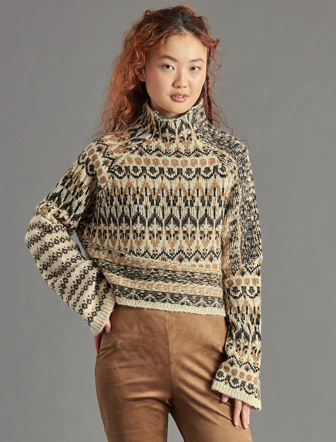 Model wearing Steve Madden's indie sweater in multi.