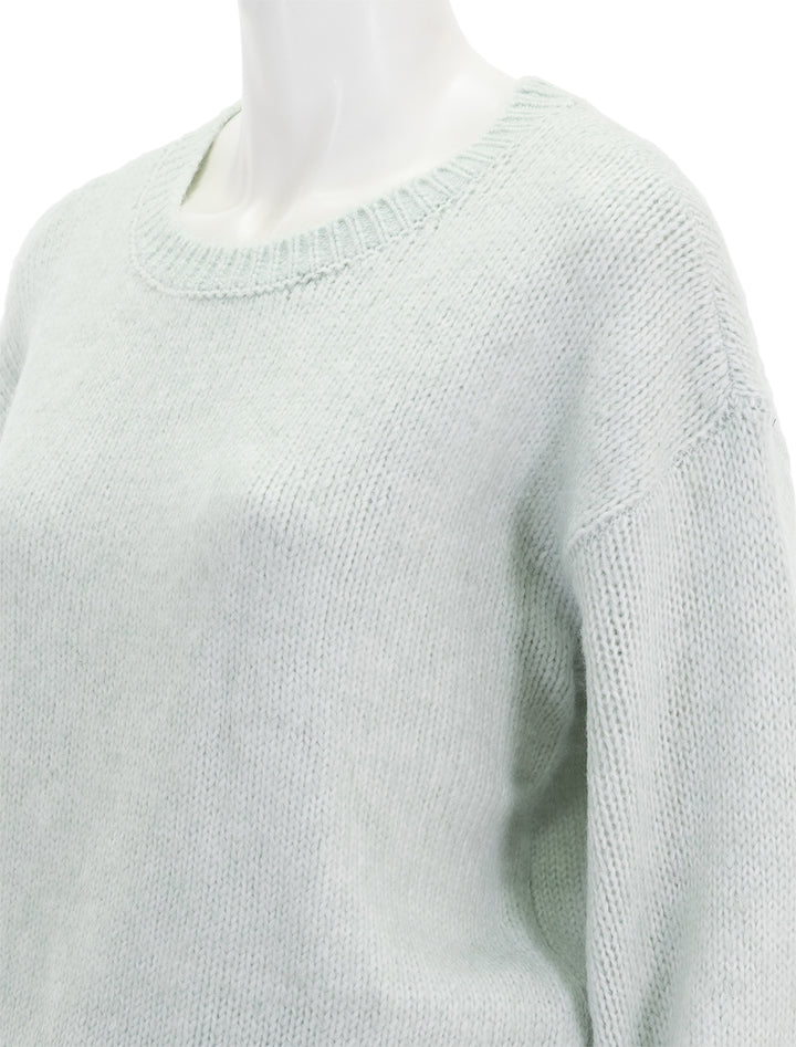Close-up view of Steve Madden's colette sweater in jade cream.
