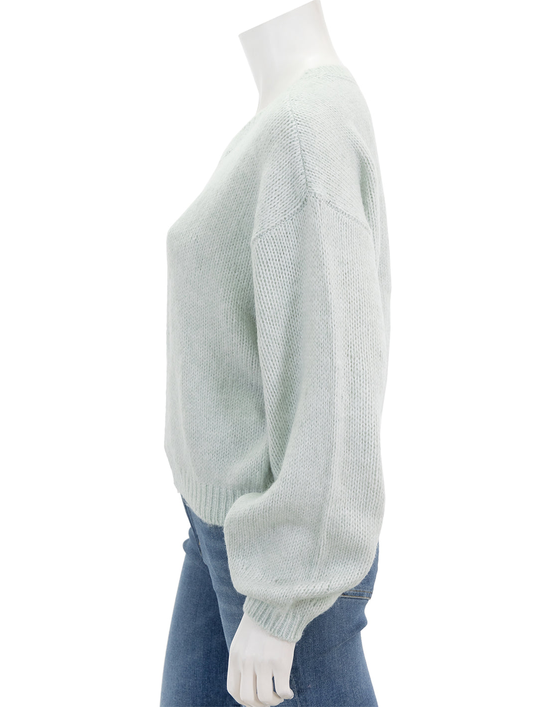 Side view of Steve Madden's colette sweater in jade cream.