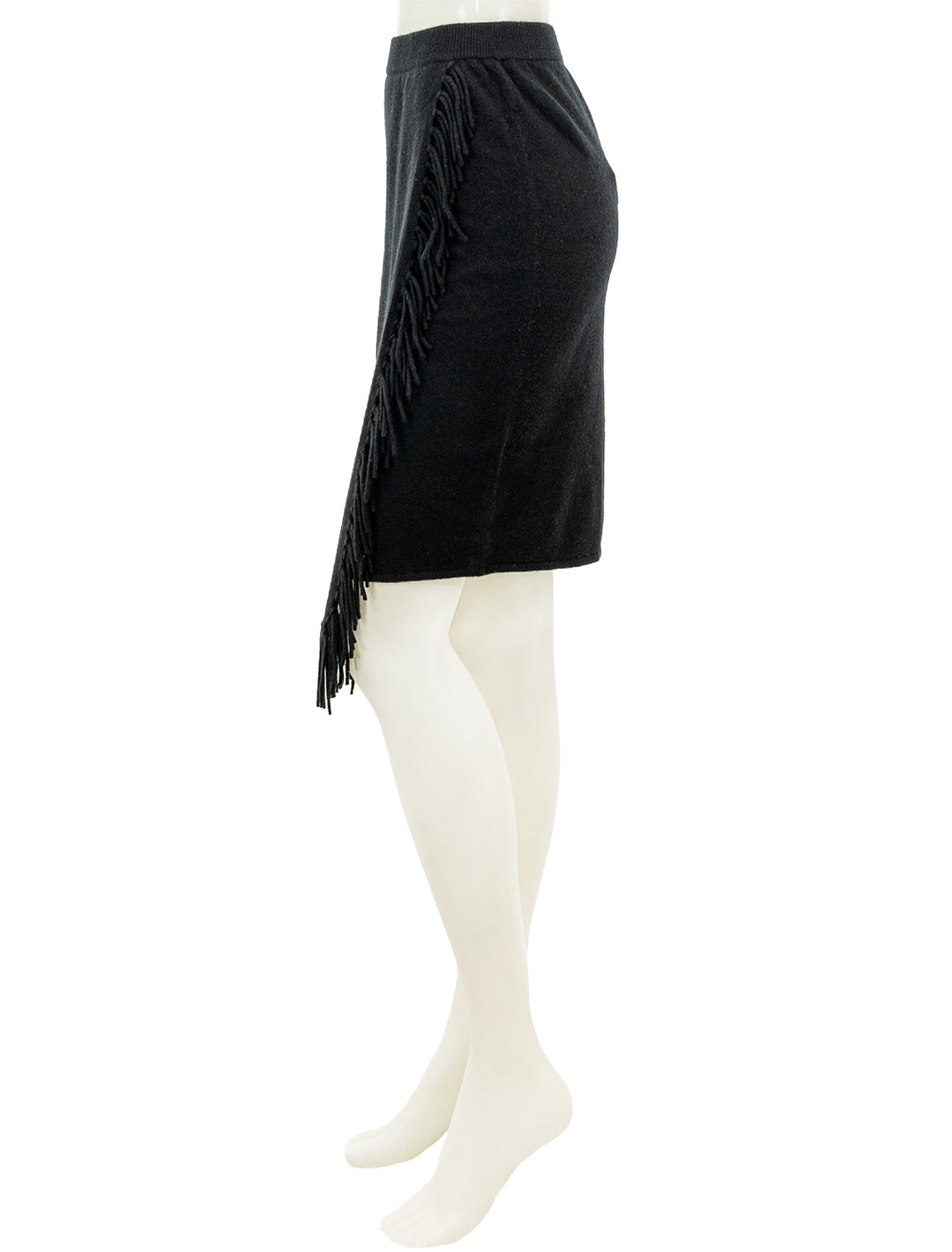 Side view of Minnie Rose's wrap skirt with fringe in black.