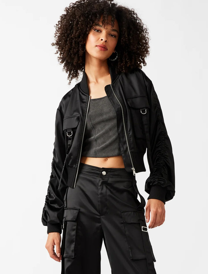 Model wearing Steve Madden's costa jacket in black.