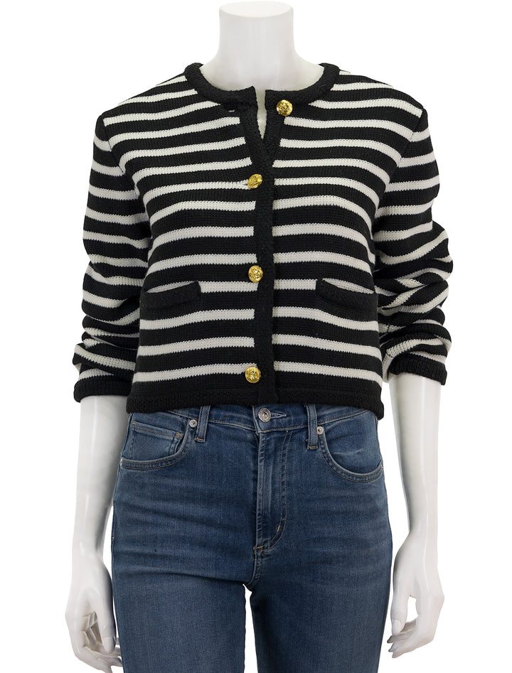 Front view of English Factory's cardigan in black and ivory stripe, buttoned.