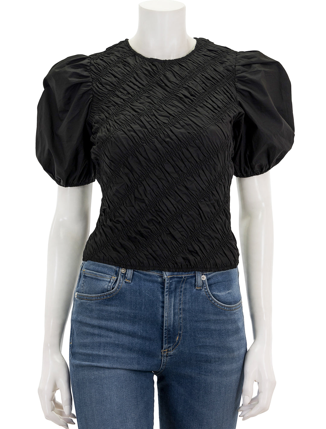 Front view of English Factory's asymmetrical smocked top in black.