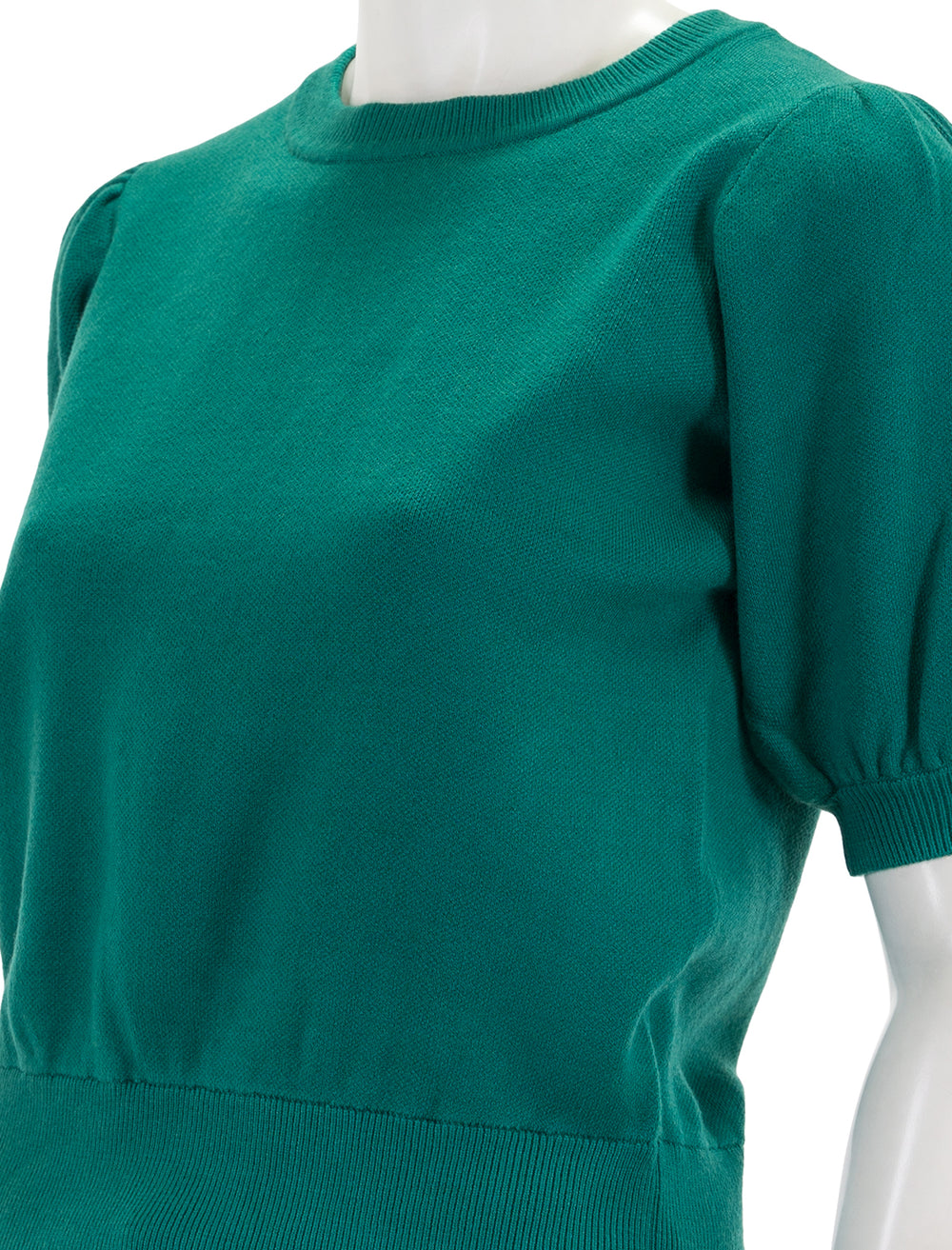 Close-up view of English Factory's puff sleeve pullover in emerald.