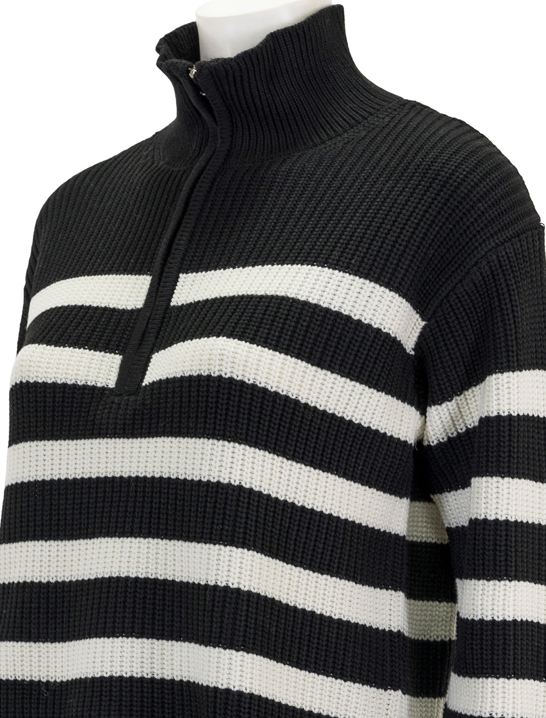 Close-up view of English Factory's striped half zip sweater in black and white.