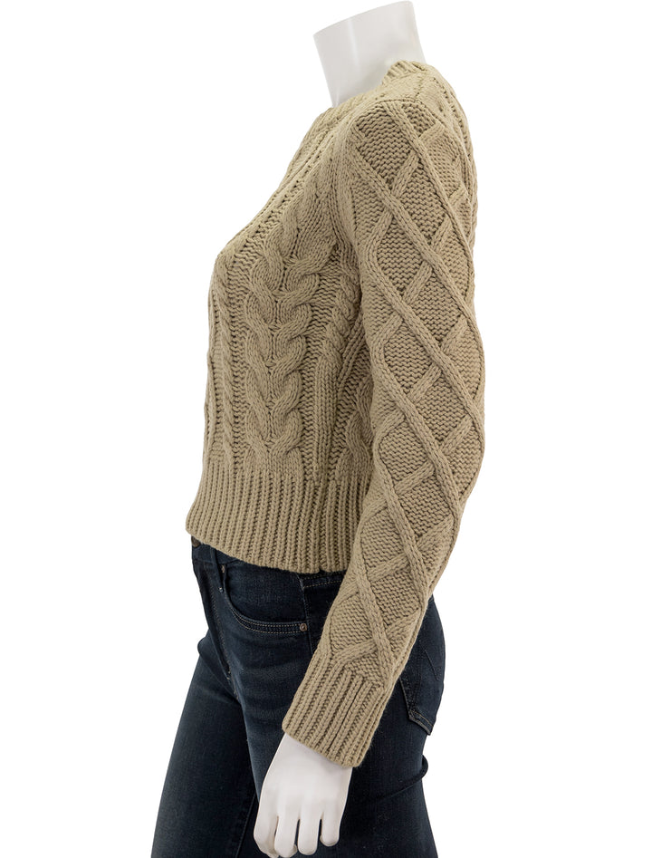 Side view of English Factory's cable knit sweater in oatmeal.