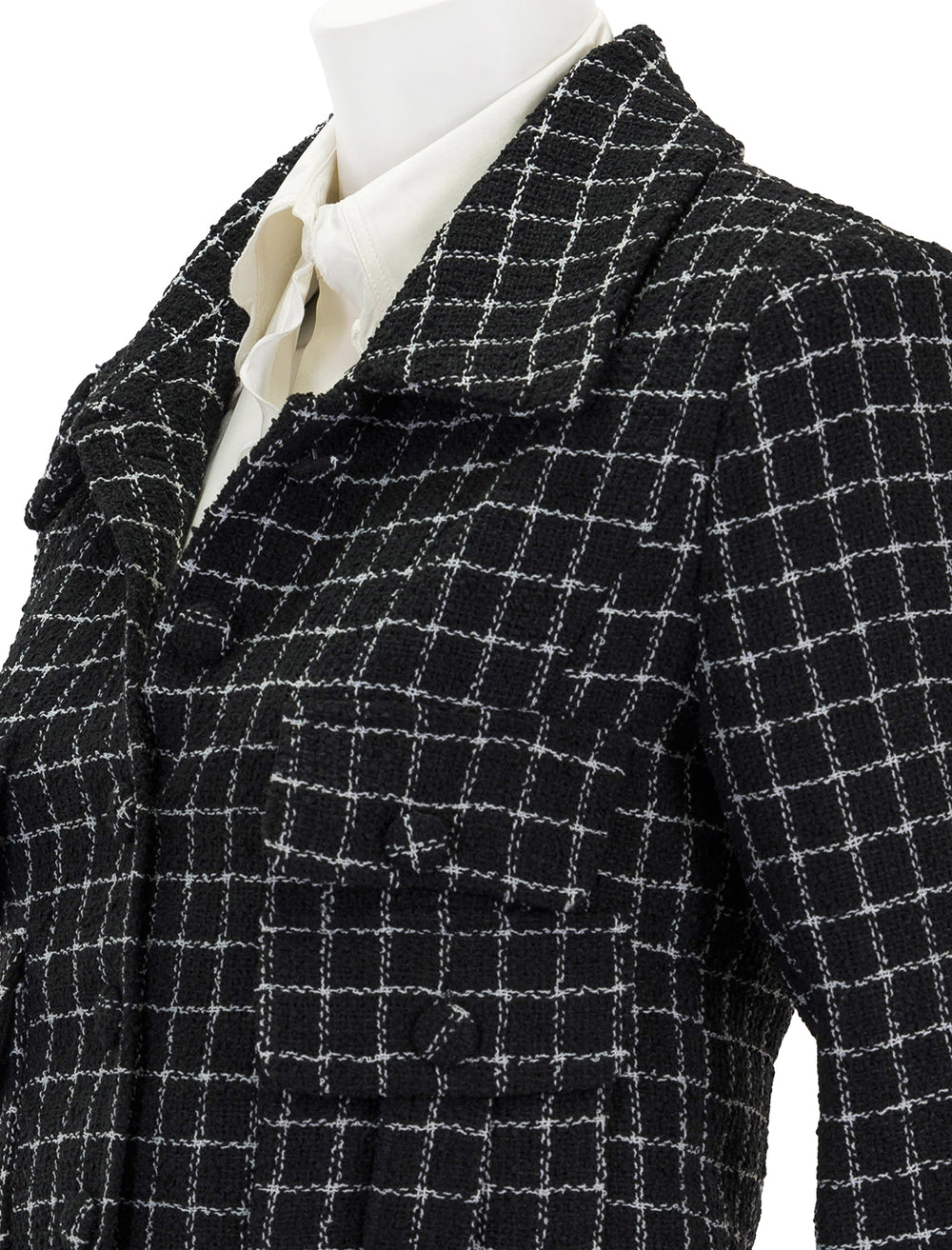 Close-up view of English Factory's tweed jacket in black and white.