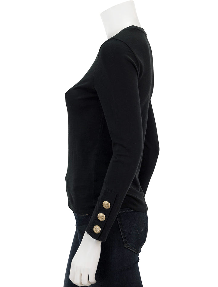 Side view of Nation LTD's kiana crew with button cuff detail in jet black.