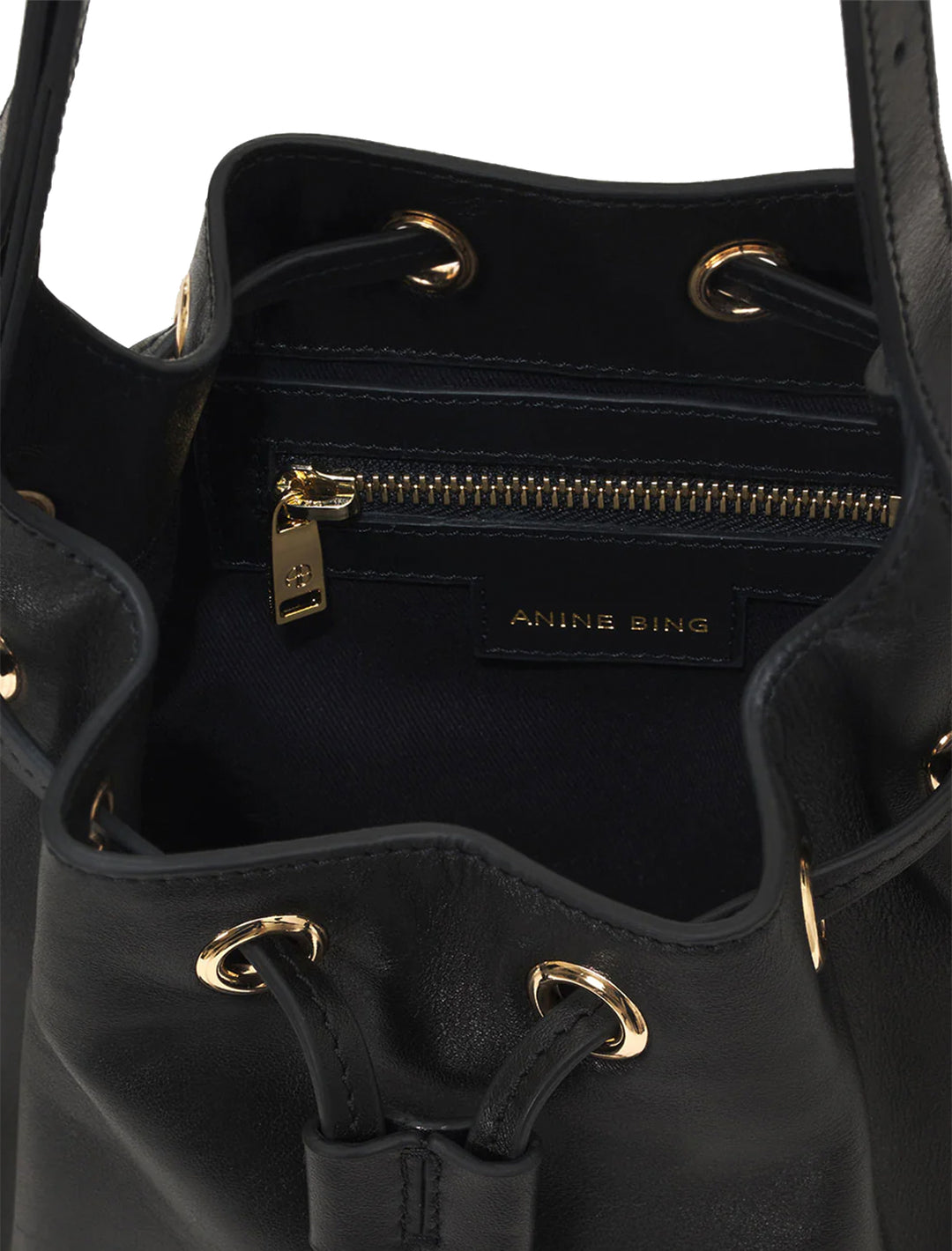 Inside view of Anine Bing's alana mini bucket bag in black.