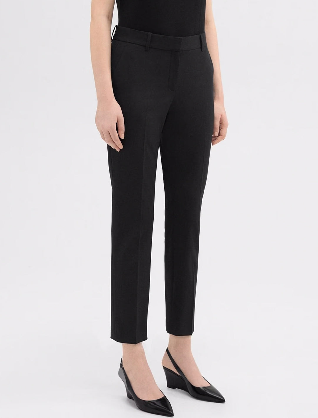 Model wearing Theory's treeca pant in goodwool | black.
