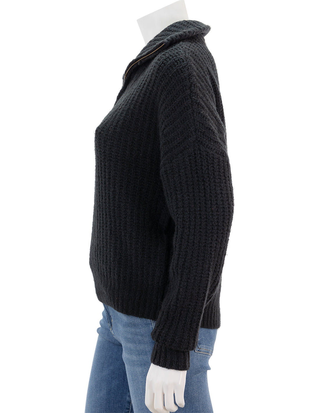 Side view of Lilla P.'s ribbed half zip sweater in black.