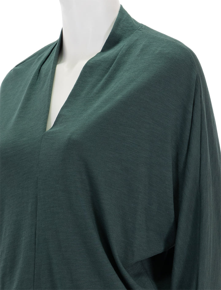 Close-up view of Lilla P.'s full sleeve split neck dolman top in elm.
