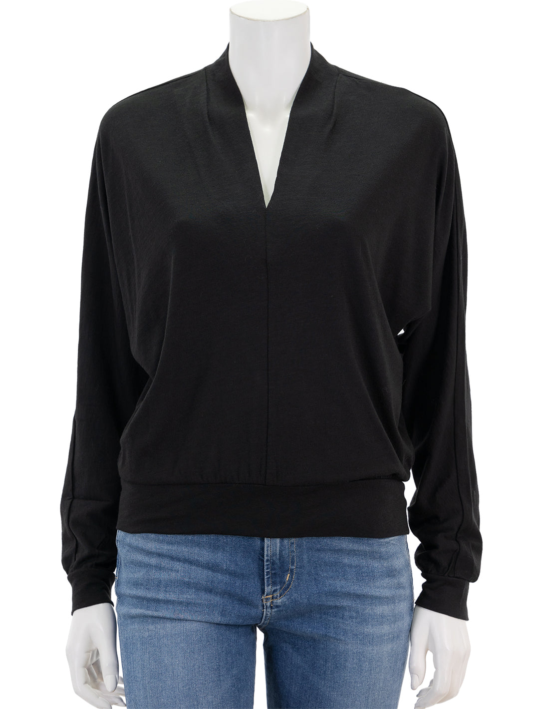 Front view of Lilla P.'s full sleeve split neck top in black.